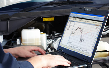 Technician looking at vehicle diagnostics
