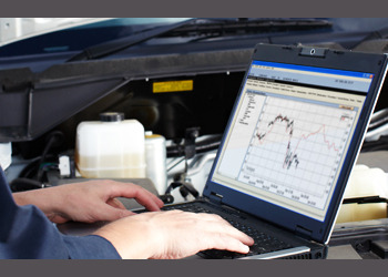 Technician looking at vehicle diagnostics